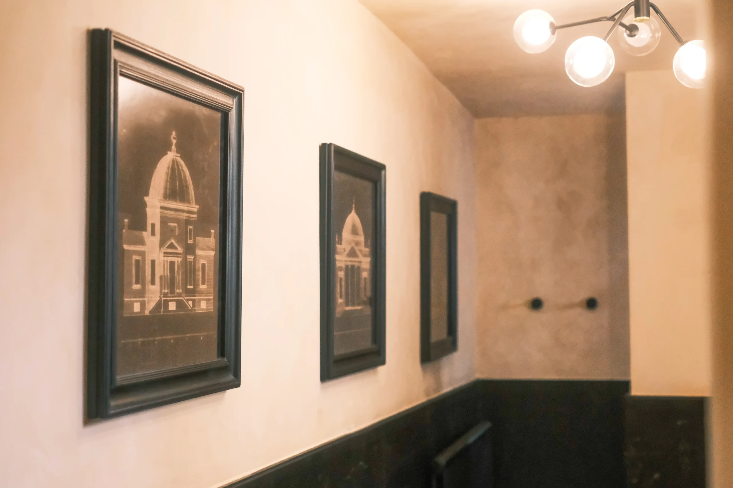 Luxury bathroom with glass shower, stone sink and soft ambient lighting