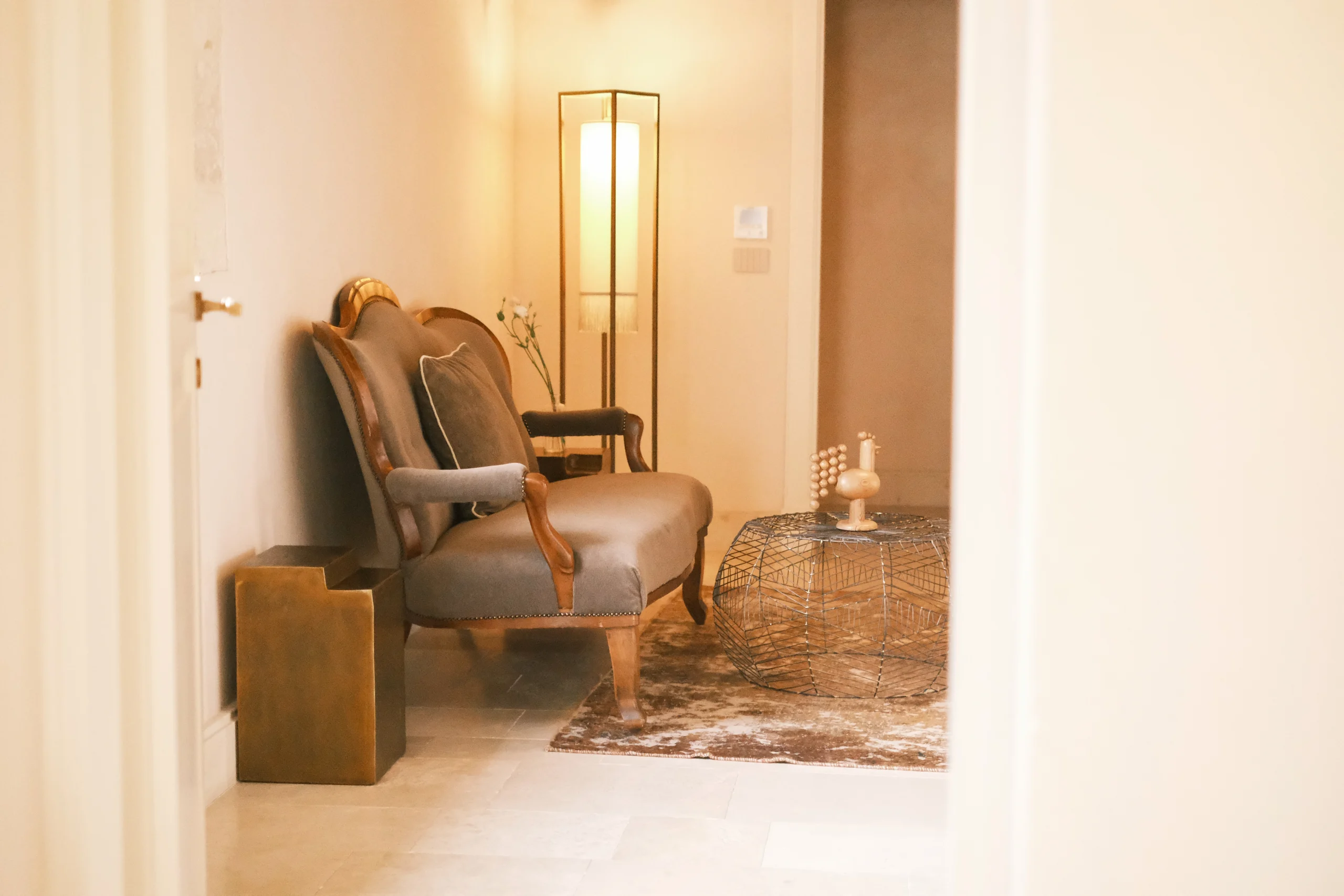 Elegant seating area with armchairs and floor lamp in a luxury villa bedroom