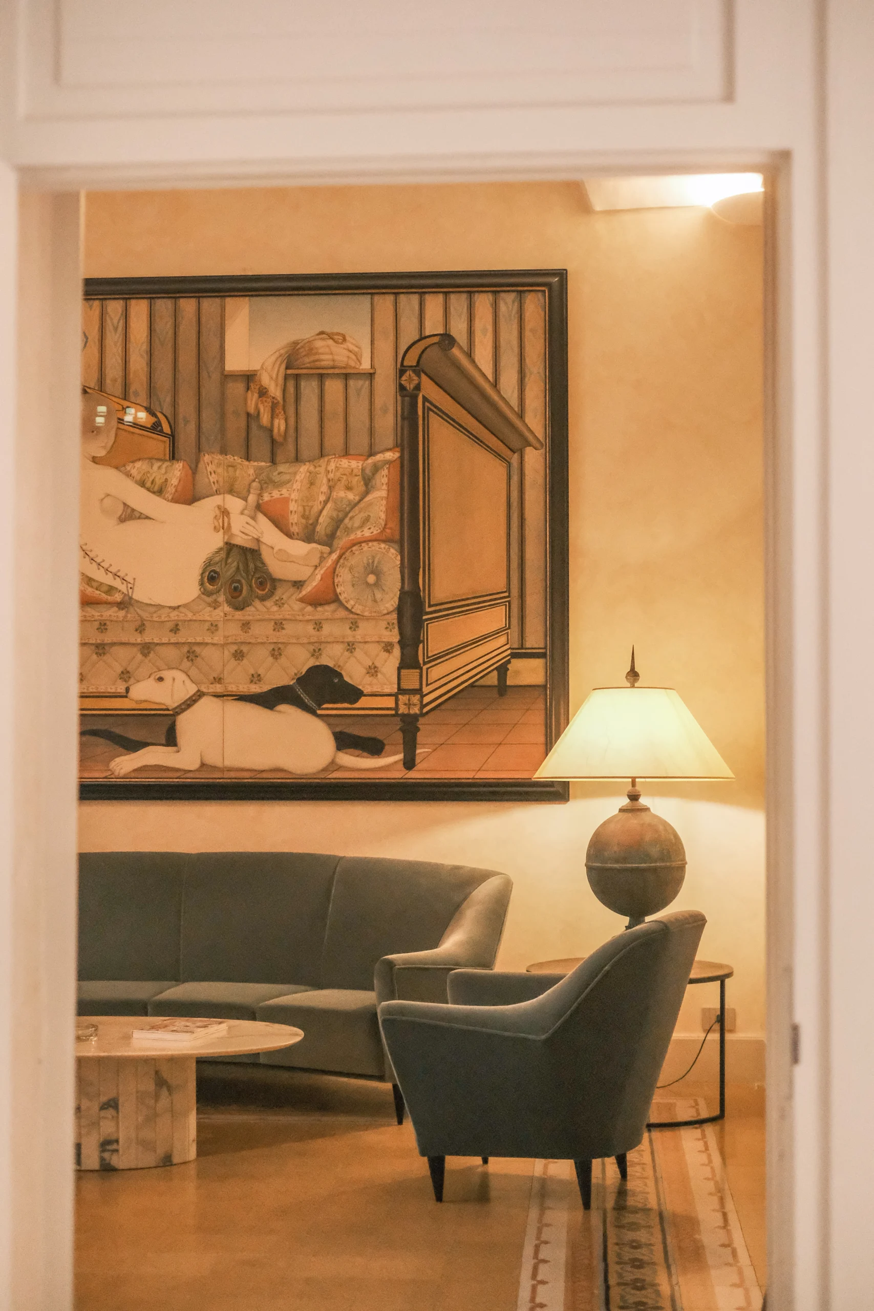 Elegant living room with vaulted ceilings, curated art collection, and refined seating in a historic Italian residence