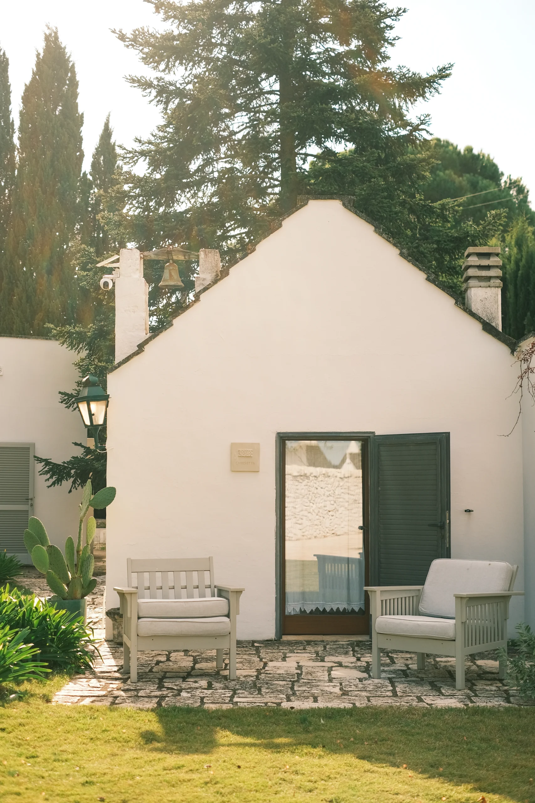 Unique bedroom inside restored chapel with bespoke lighting and serene atmosphere in Puglia villa