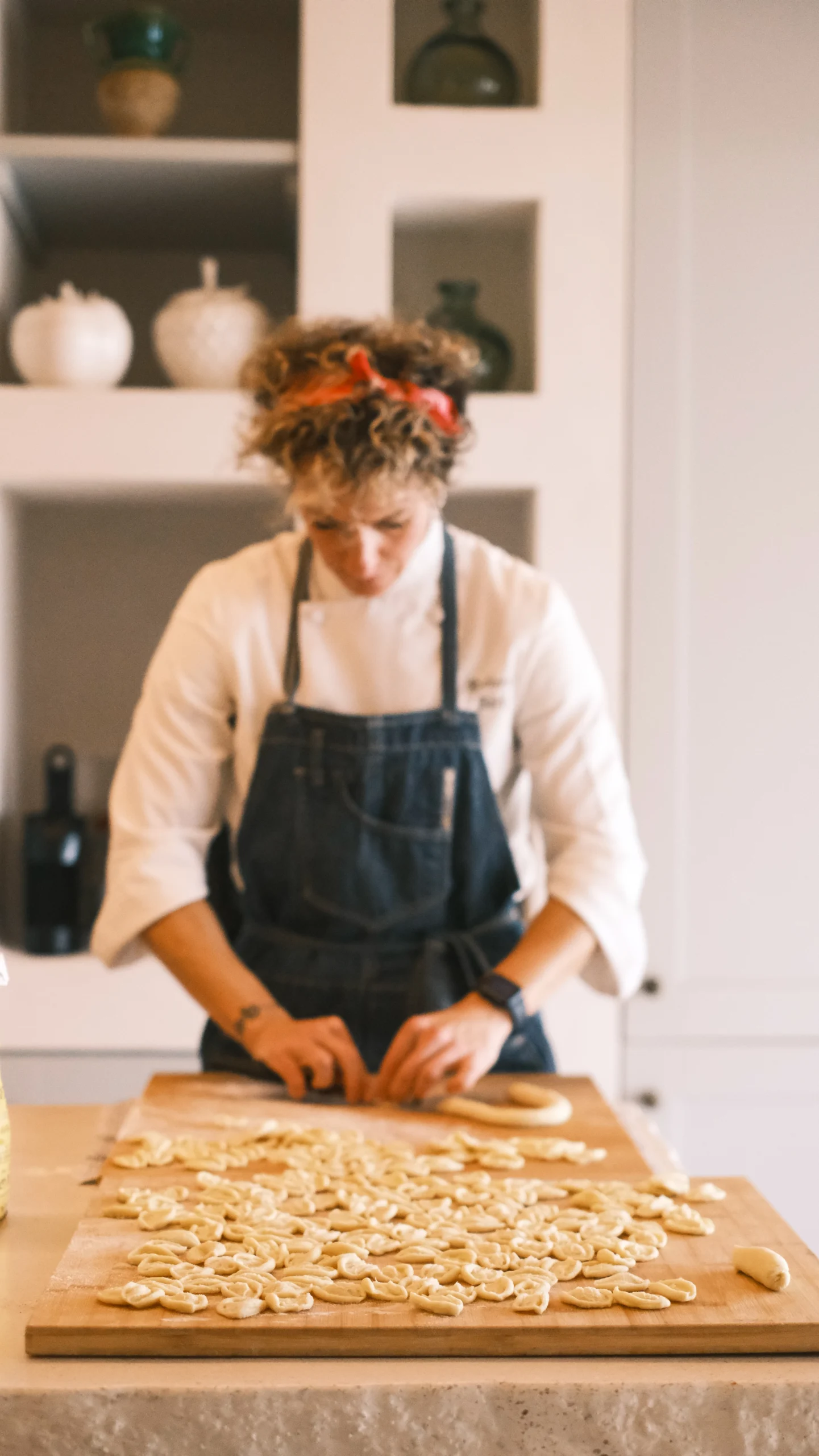 Private chef preparing handmade pasta in a luxury villa kitchen in Puglia