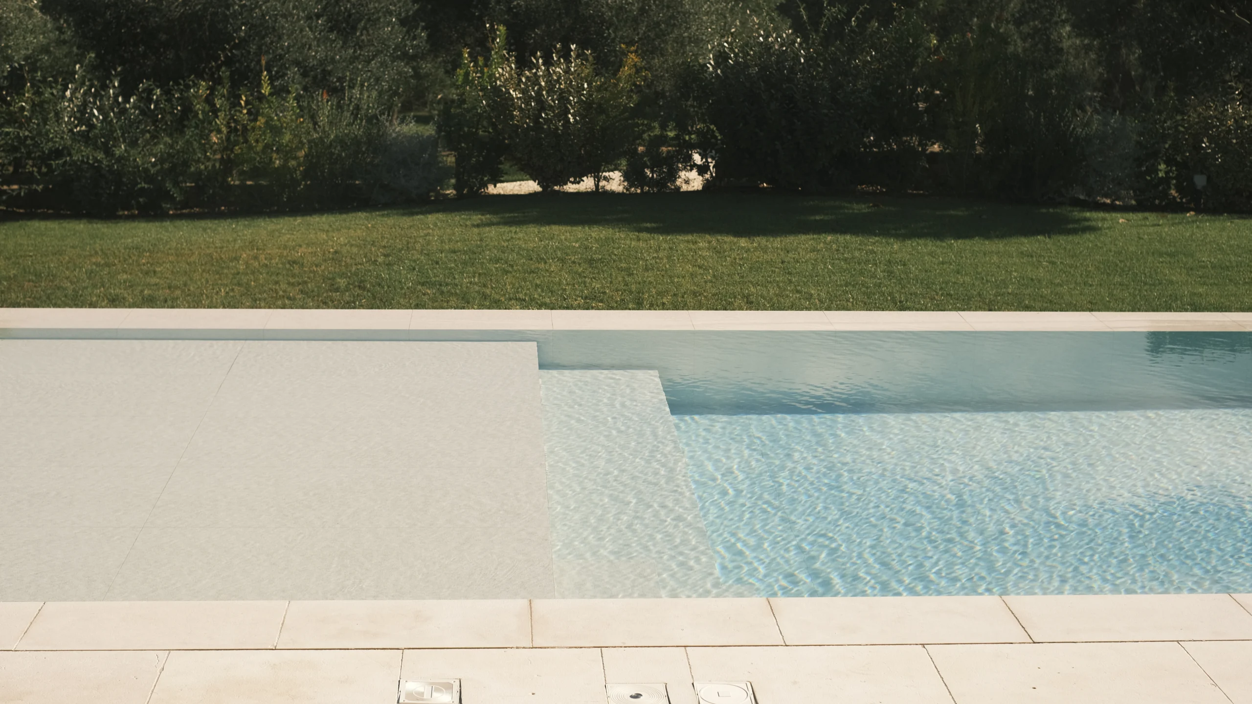 Swimming pool with pergola and outdoor dining area in a luxury Puglian villa