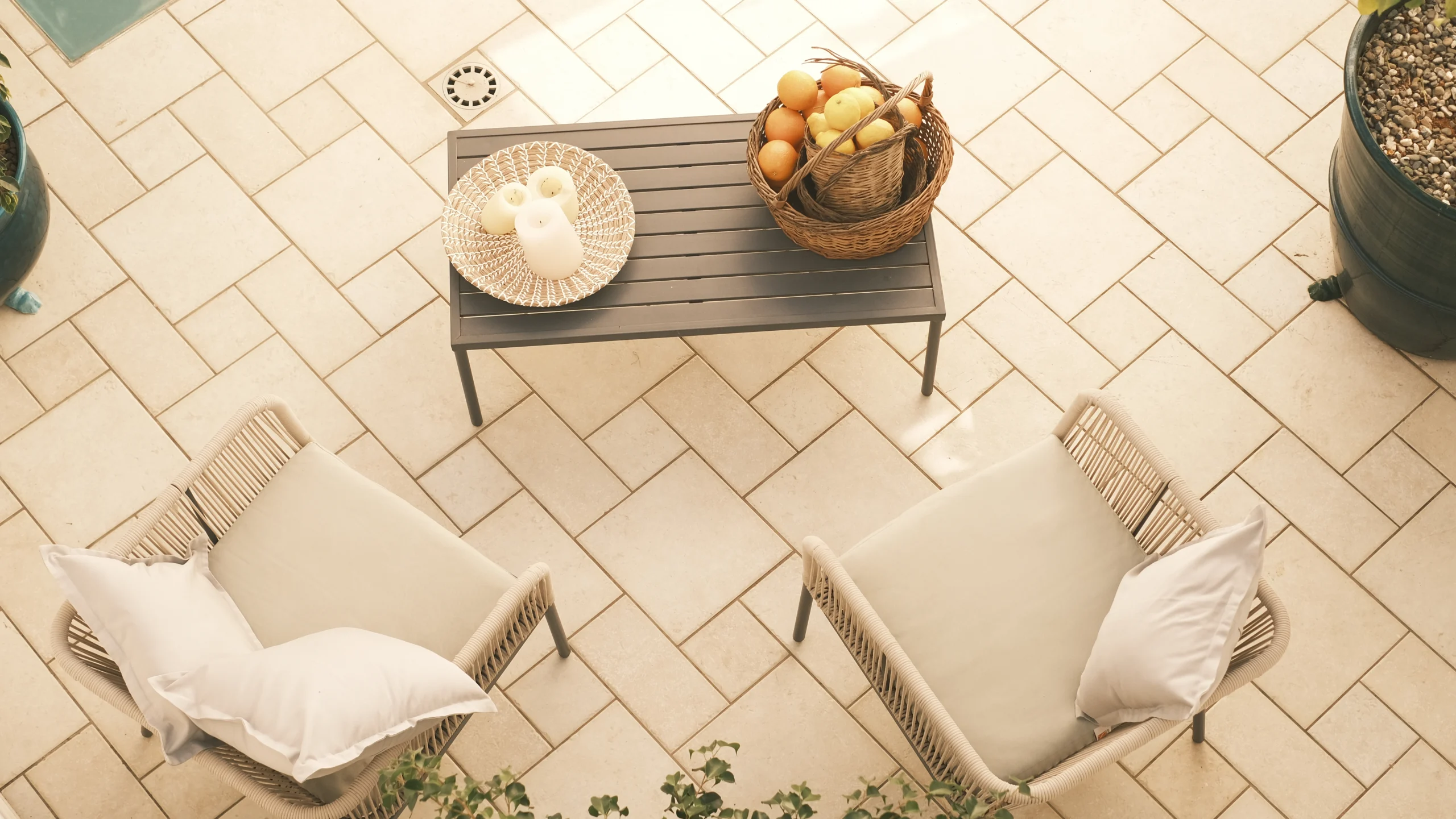 Elegant outdoor coffee table with fresh fruit and candles on terrace at luxury villa in Puglia