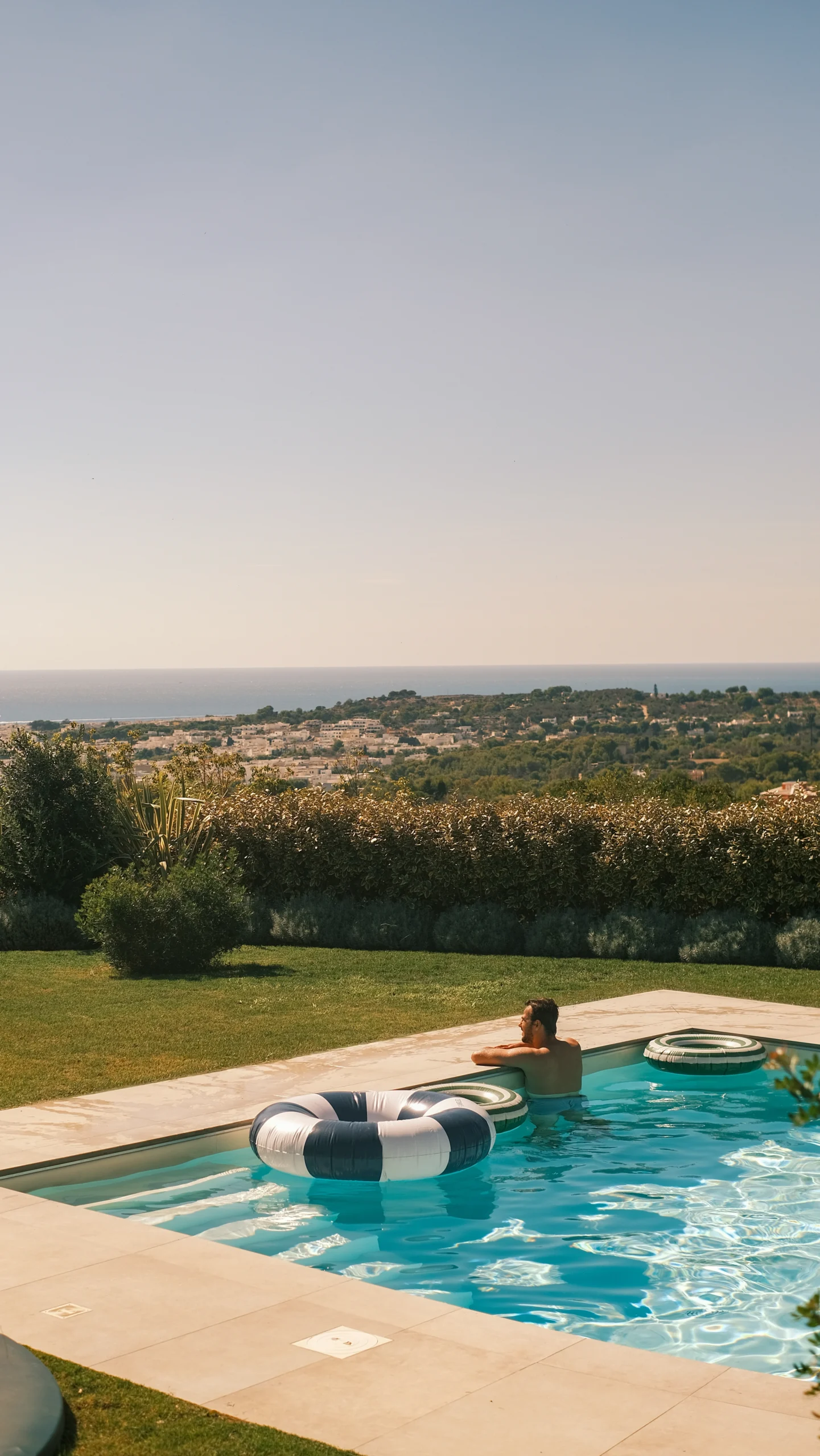 Private infinity-style swimming pool with panoramic countryside and sea views at luxury villa in Puglia