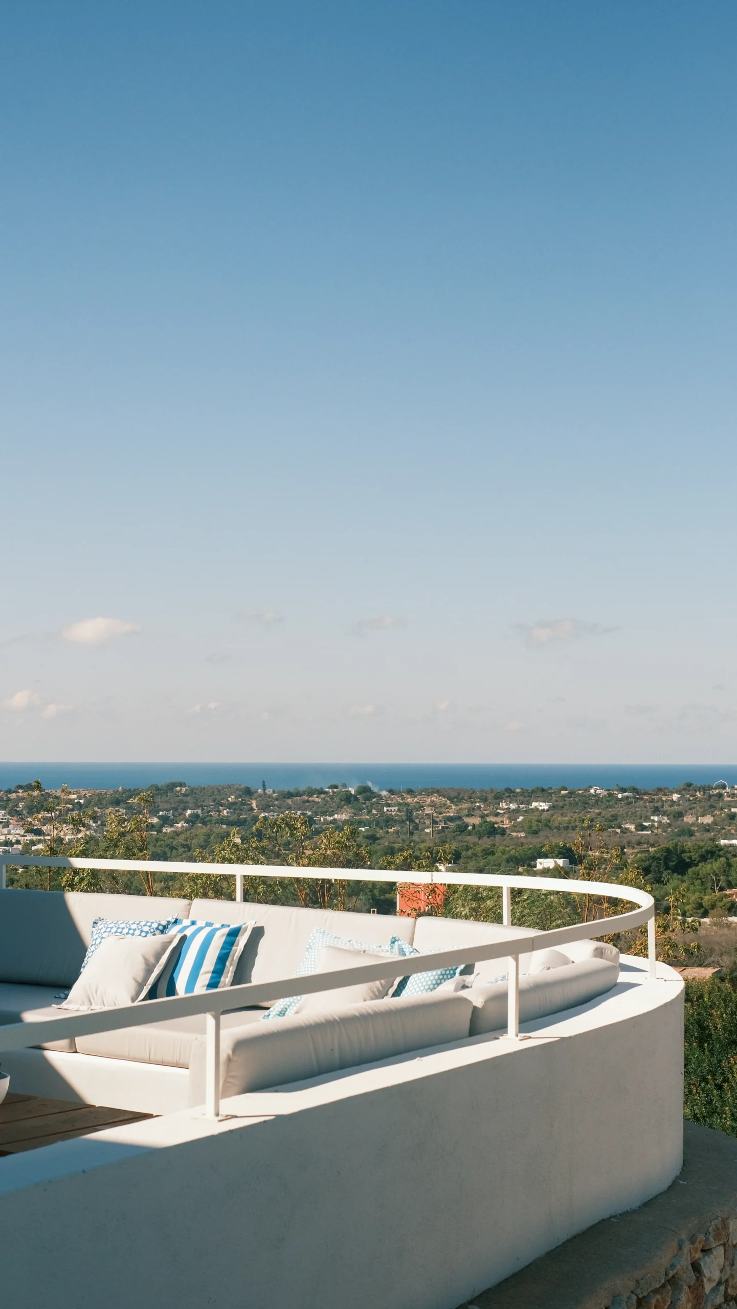 Elegant seating area with Mediterranean cushions and sweeping sea views in Puglia