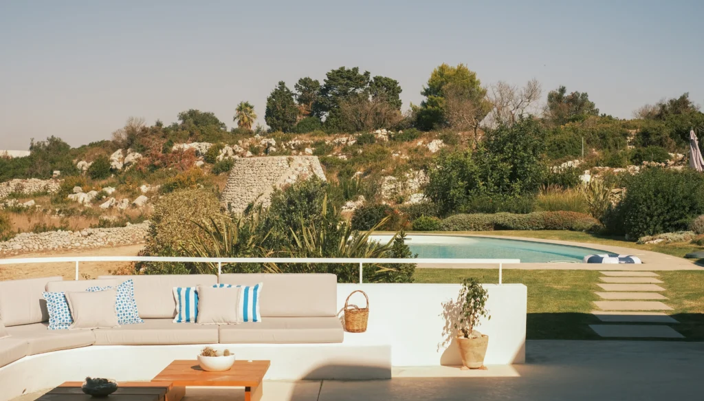 Luxury terrace overlooking olive groves, village rooftops and the Adriatic Sea in Puglia