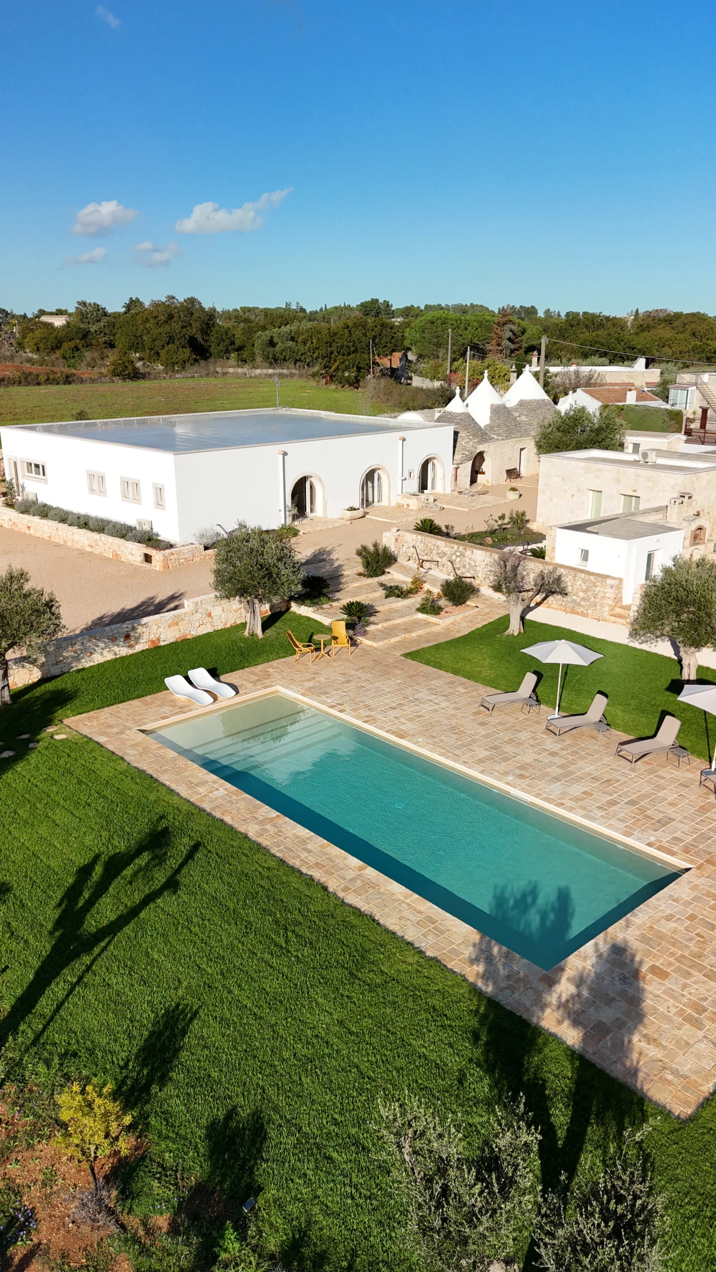 Luxury countryside villa with pool and trulli rooftops at Villa Mira, Puglia, Italy