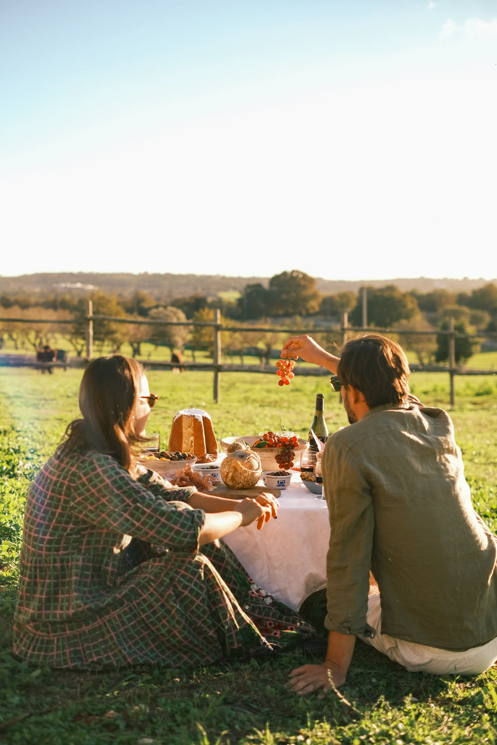 Couple enjoying a picnic at sunset in the Puglia countryside at Villa Mira