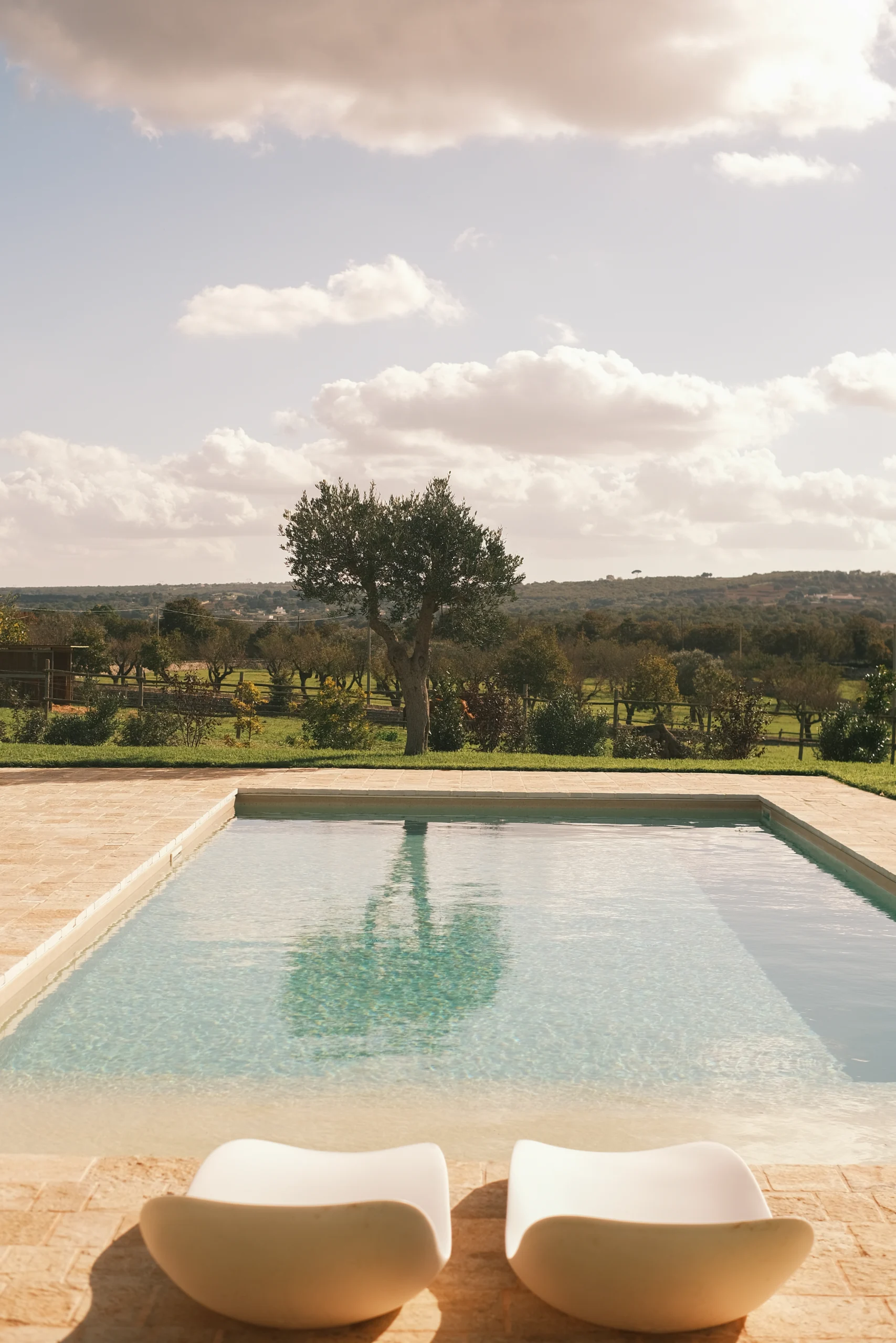 Minimalist swimming pool with countryside views at a luxury villa in Puglia
